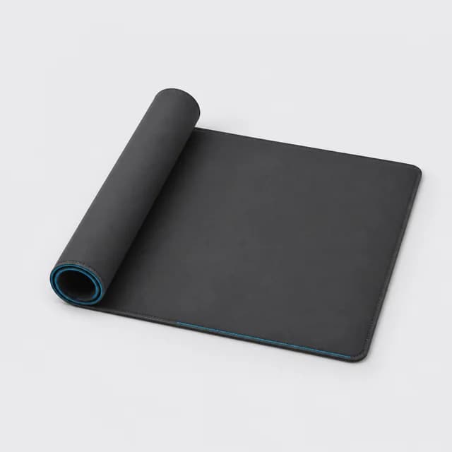 Charcoal desk mat with stitched edges